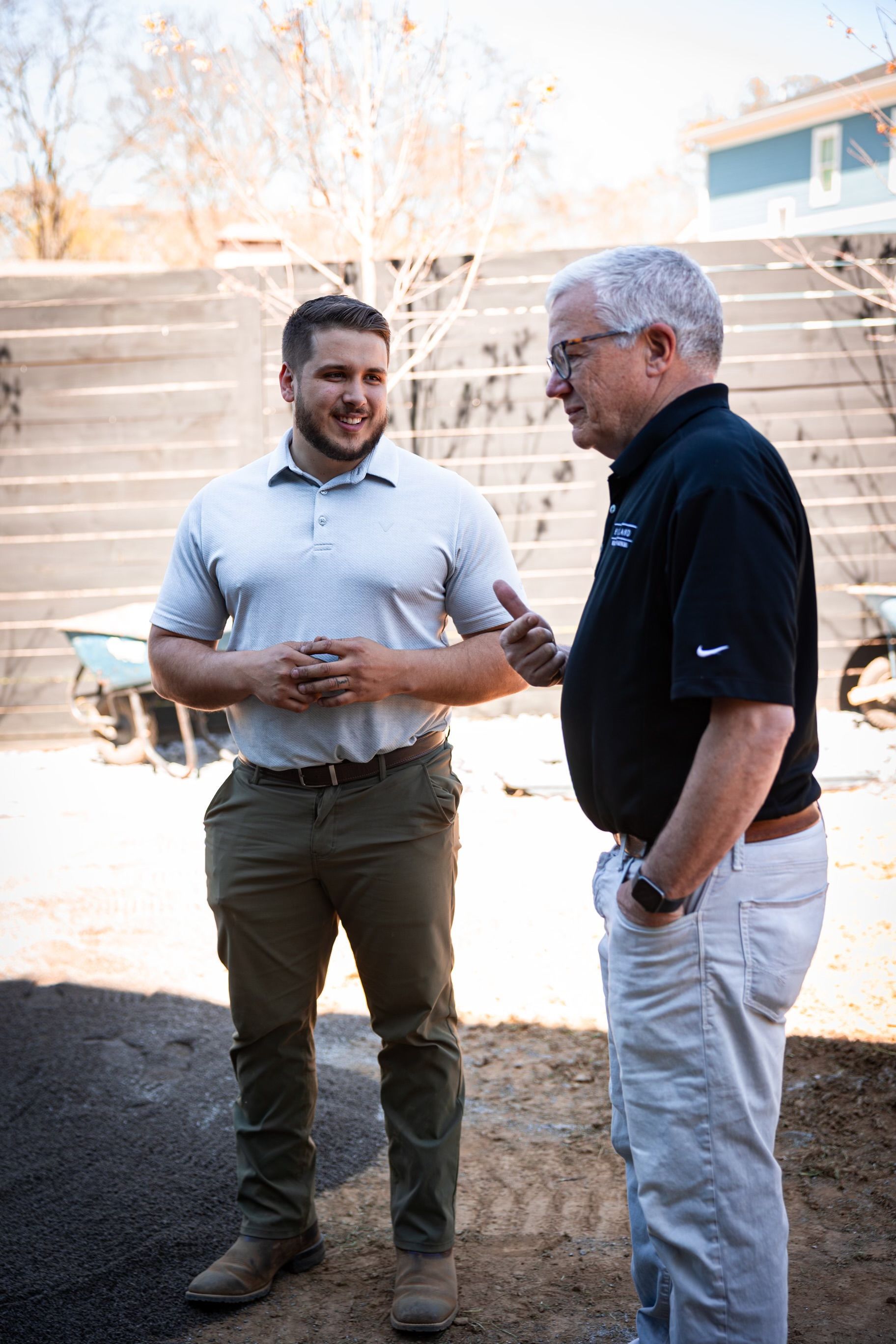 Two men are standing next to each other