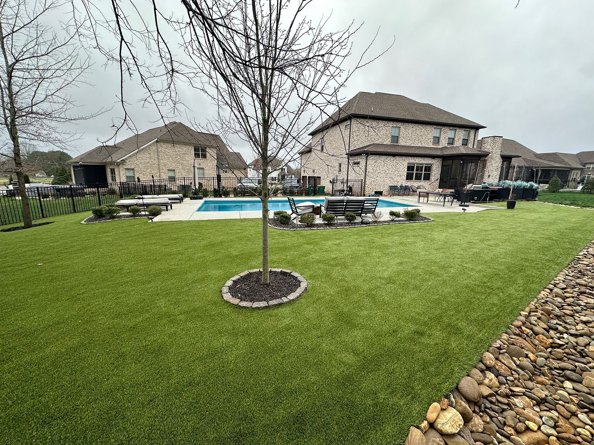 A large house with a swimming pool in the backyard