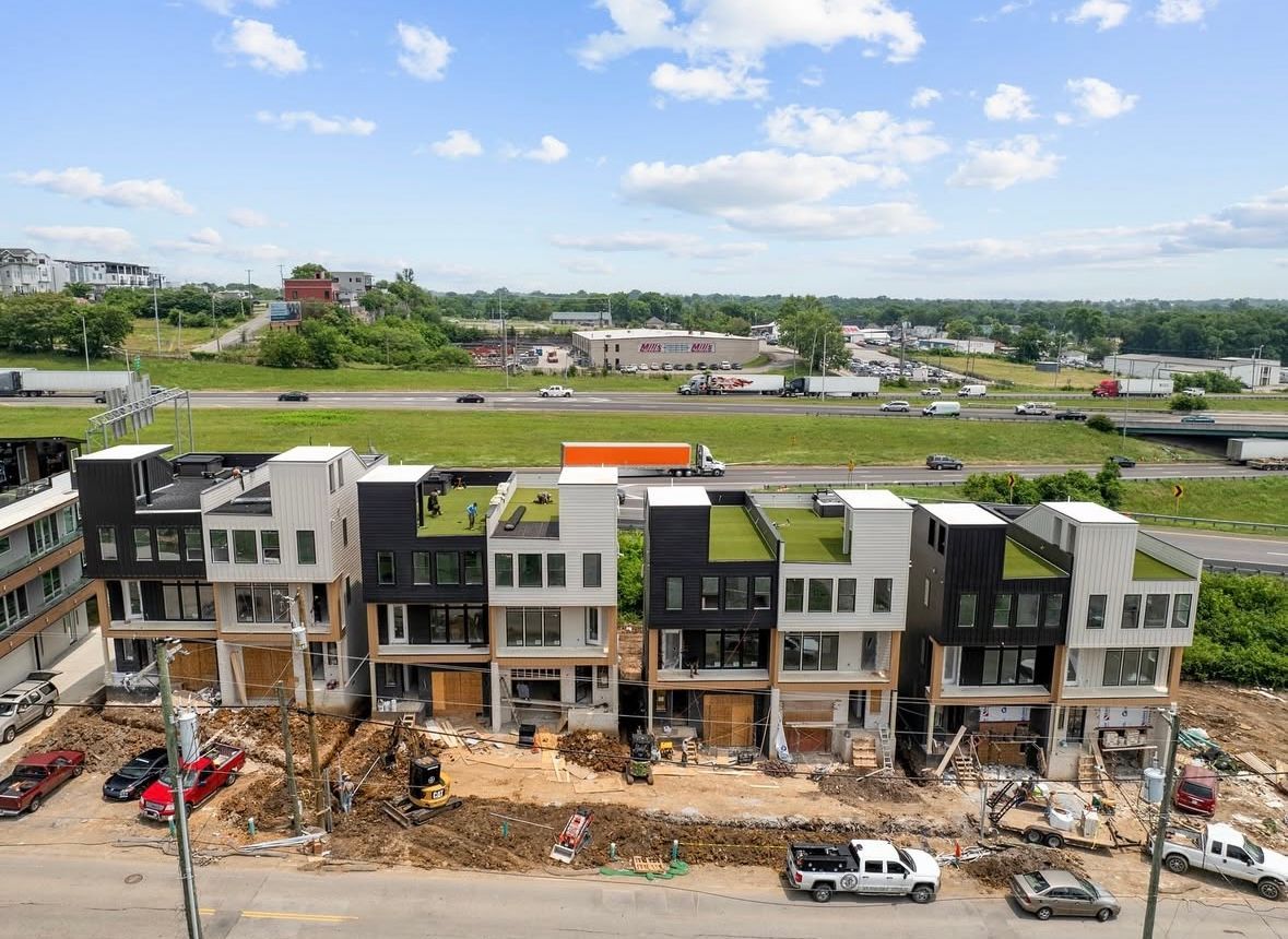 An aerial view of a row of buildings under construction.