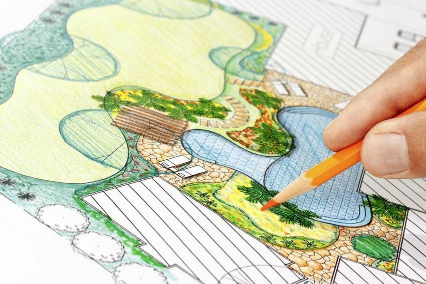 Hand sketching and coloring a landscape design with a pool.