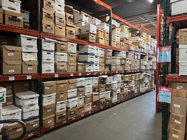 A warehouse filled with lots of boxes and shelves