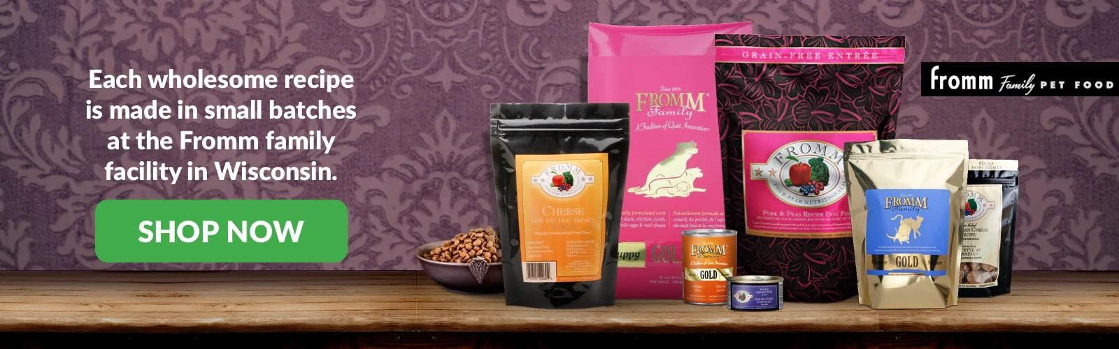 A bunch of bags of food are sitting on a wooden shelf.