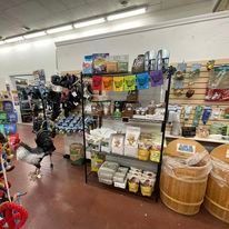 A store filled with lots of products and barrels.
