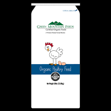 A bag of organic poultry feed with a chicken and eggs on it.