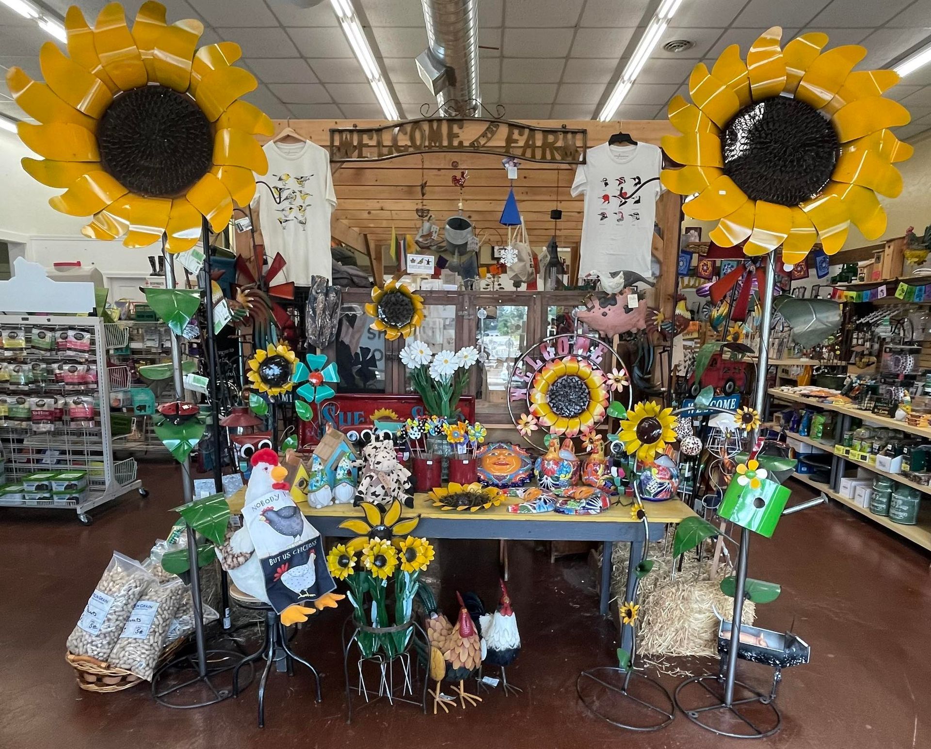 A store filled with lots of sunflowers and chickens.