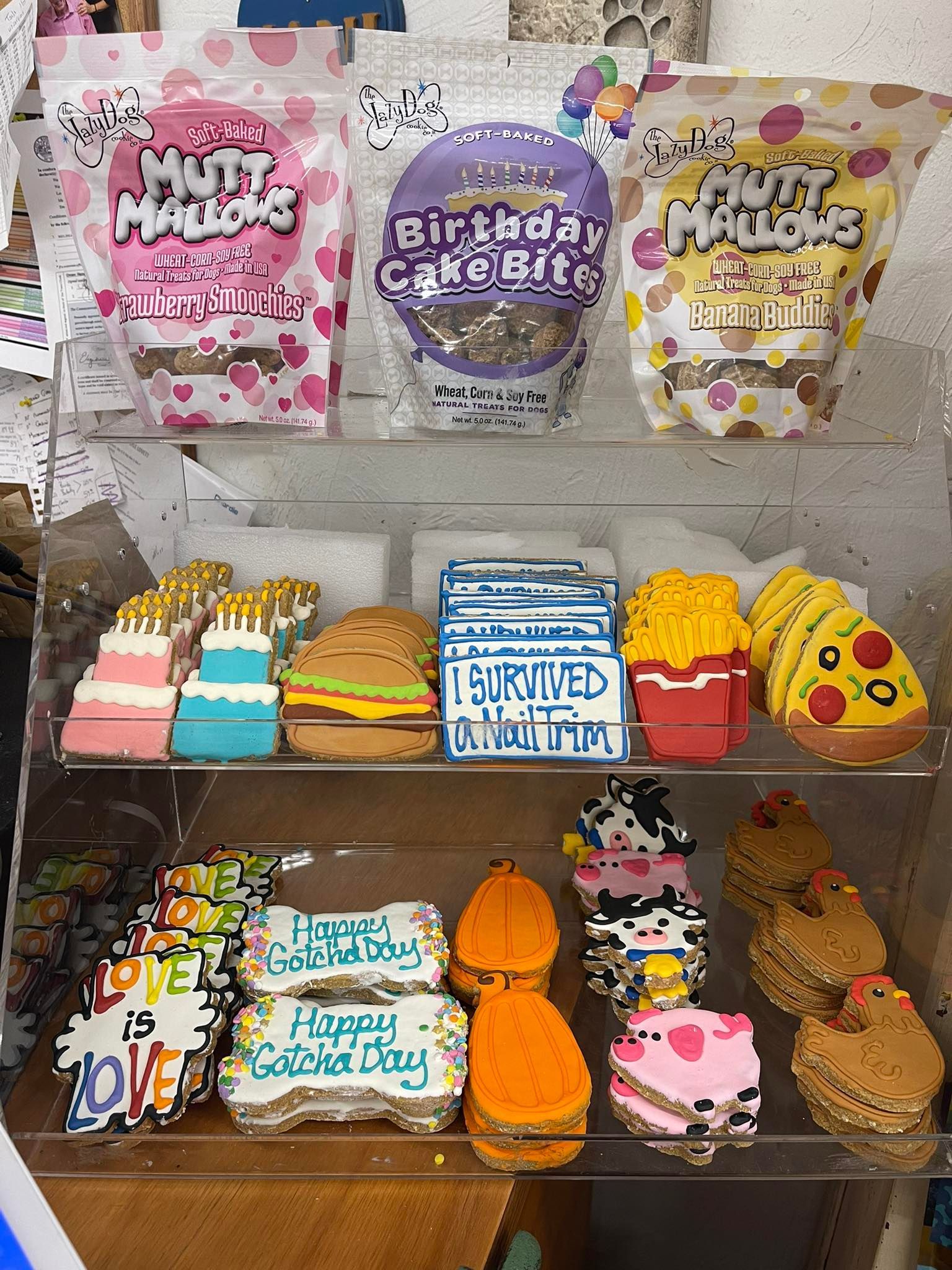 A display case filled with lots of different types of cookies.