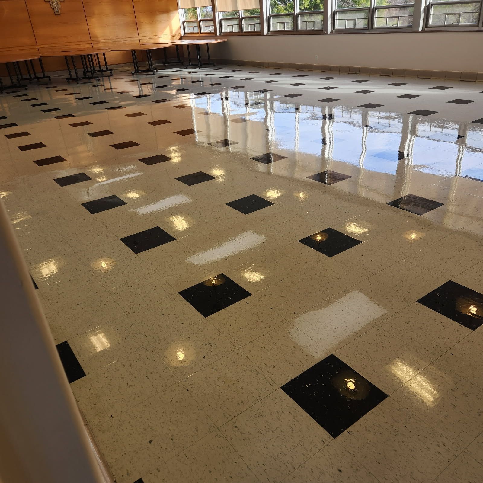 A large room with black and white tiles on the floor