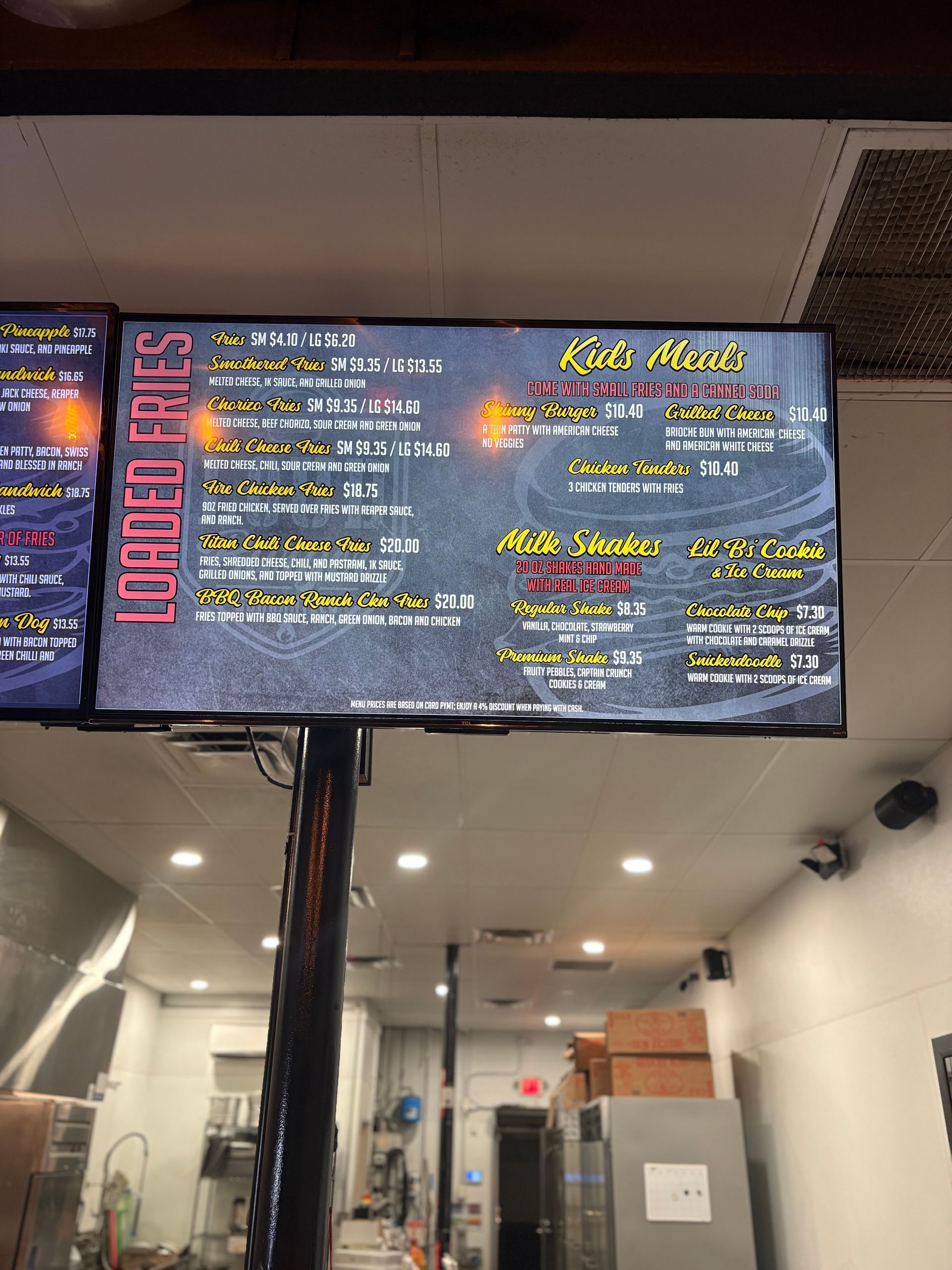 Menu board with food options displayed in a restaurant setting.