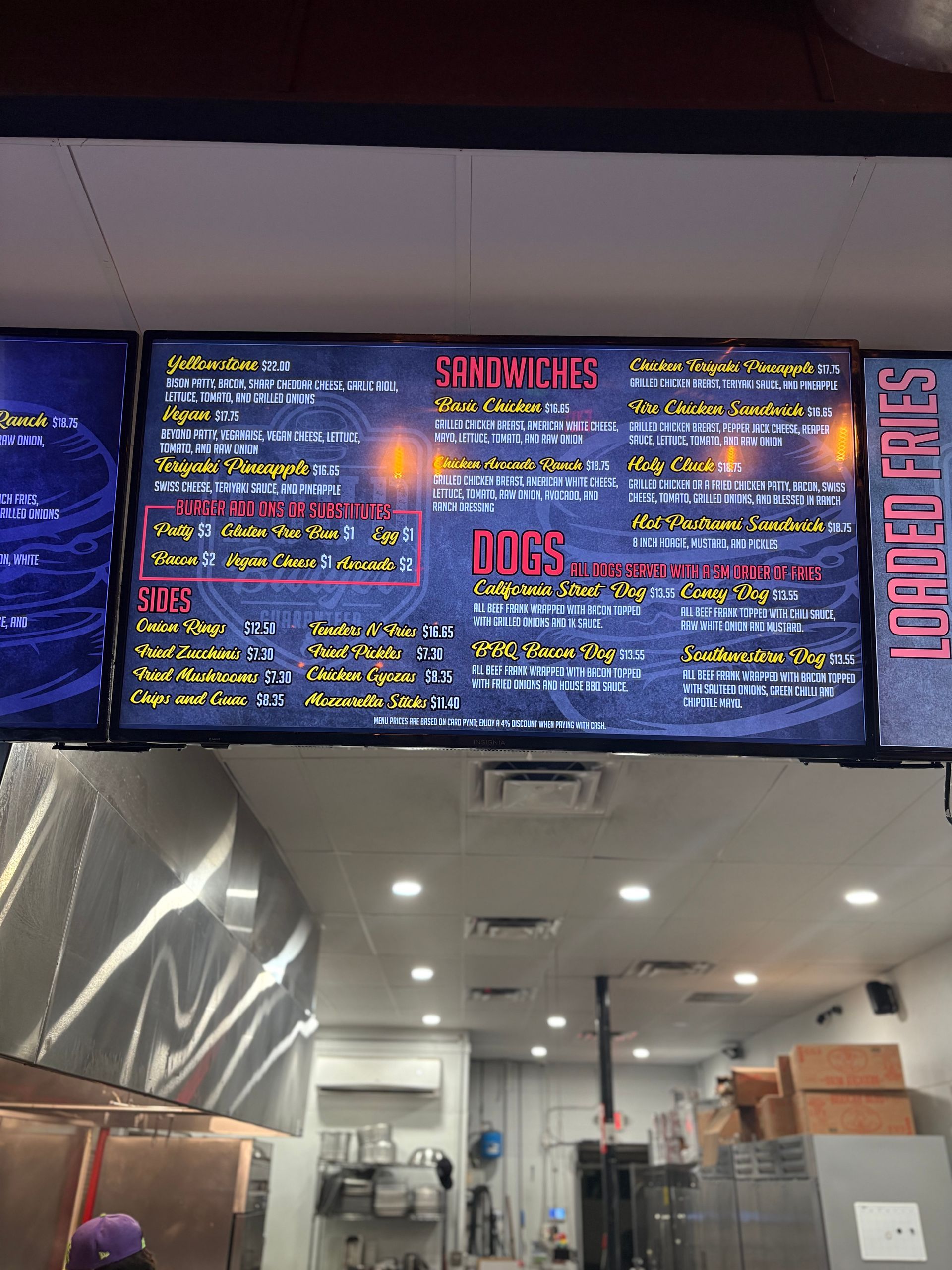 Menu board displaying food options in a restaurant.
