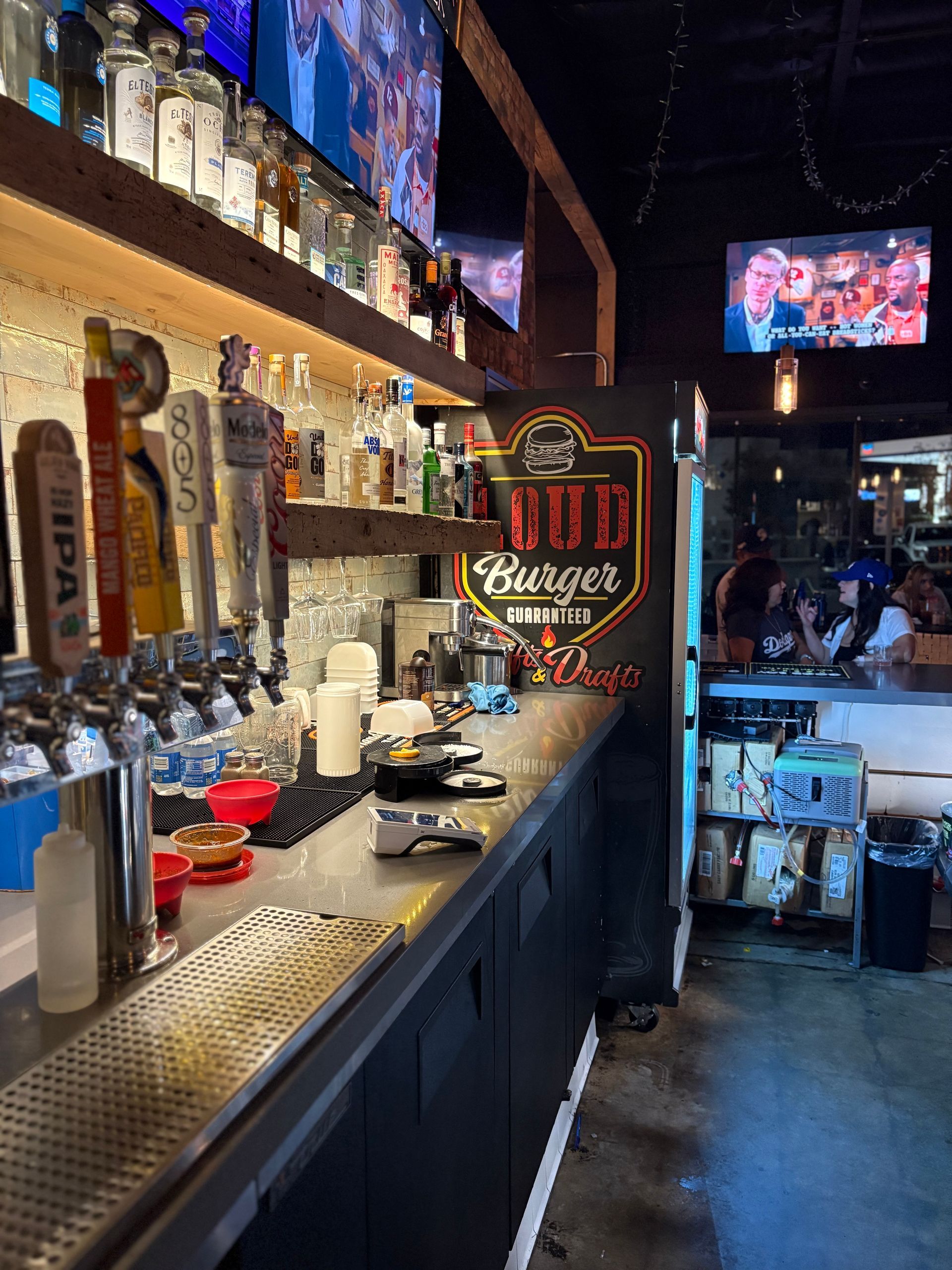 Bar interior with liquor bottles.