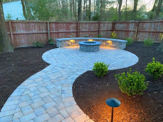 There is a fire pit in the middle of the patio.