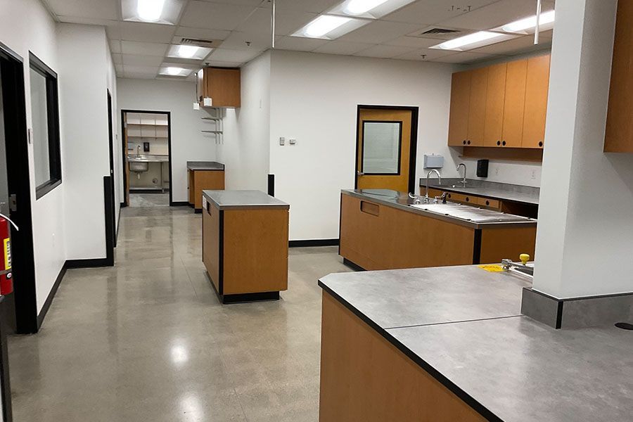 A kitchen with a lot of counters and cabinets