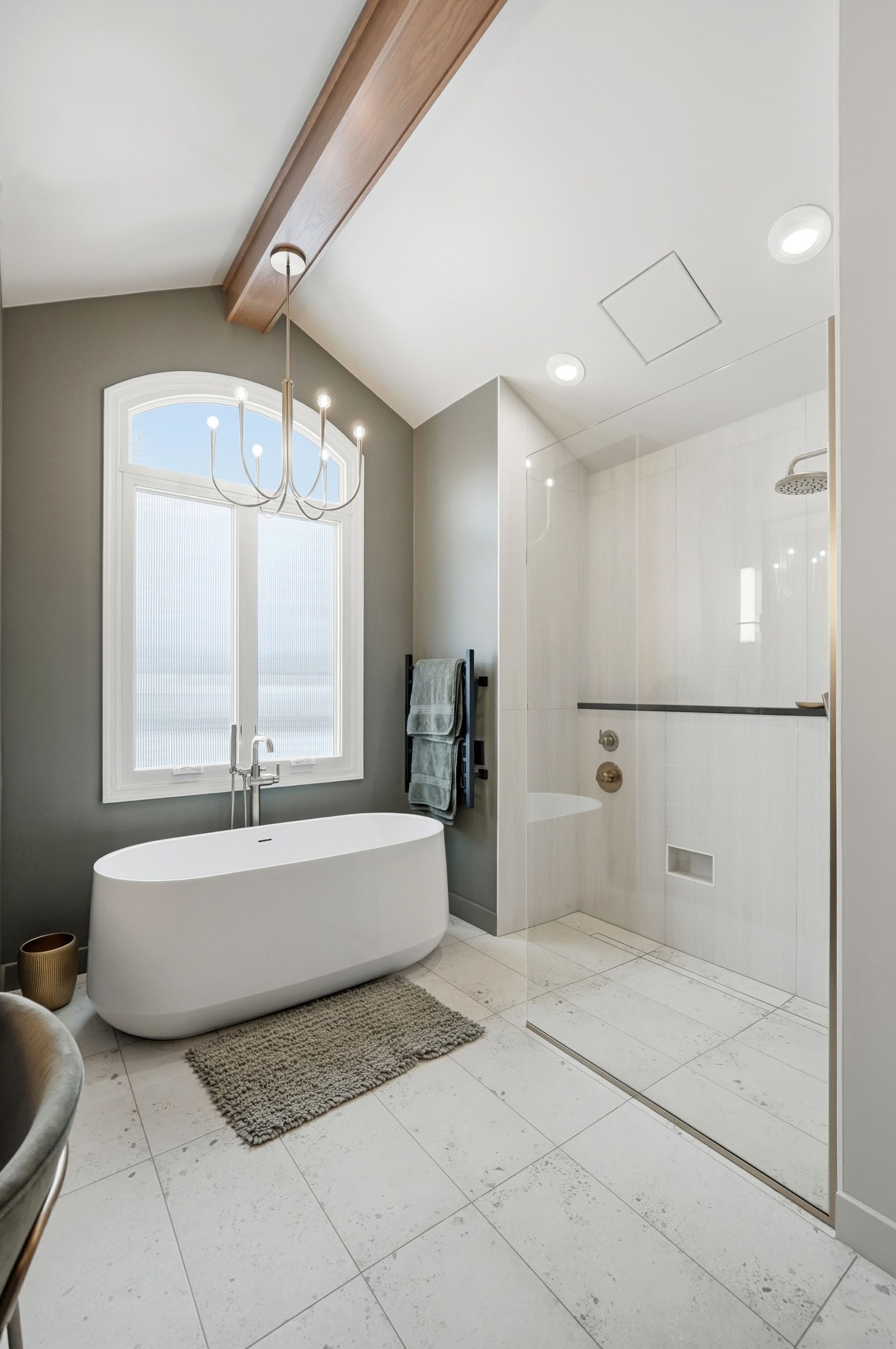 Modern bathroom with white tub, walk-in shower, and a large window.