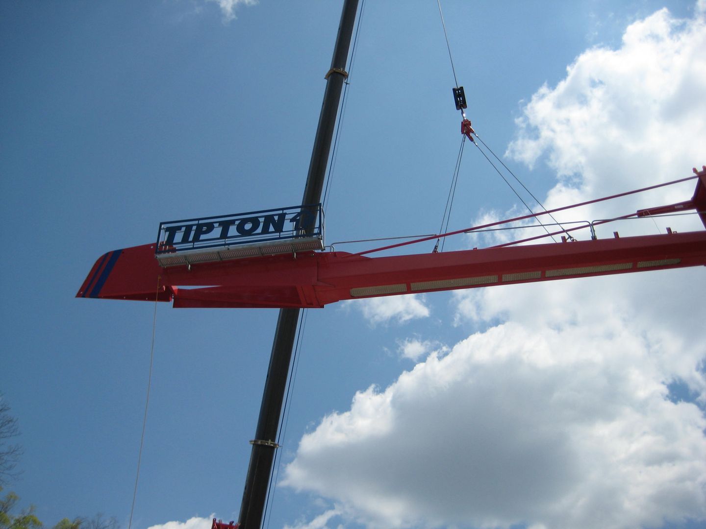 A red crane with the word tipton on it