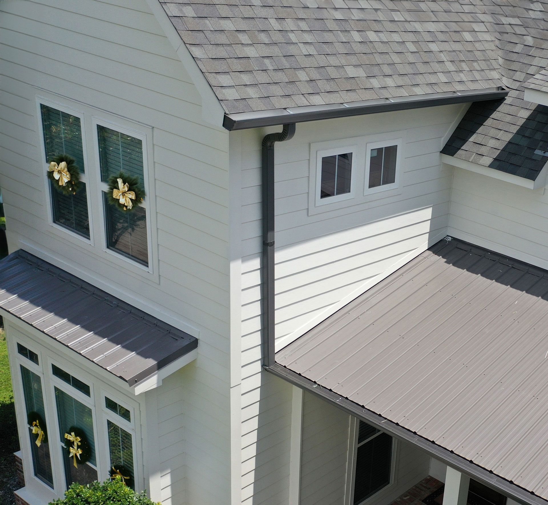 An aerial view of a house with a new roof.