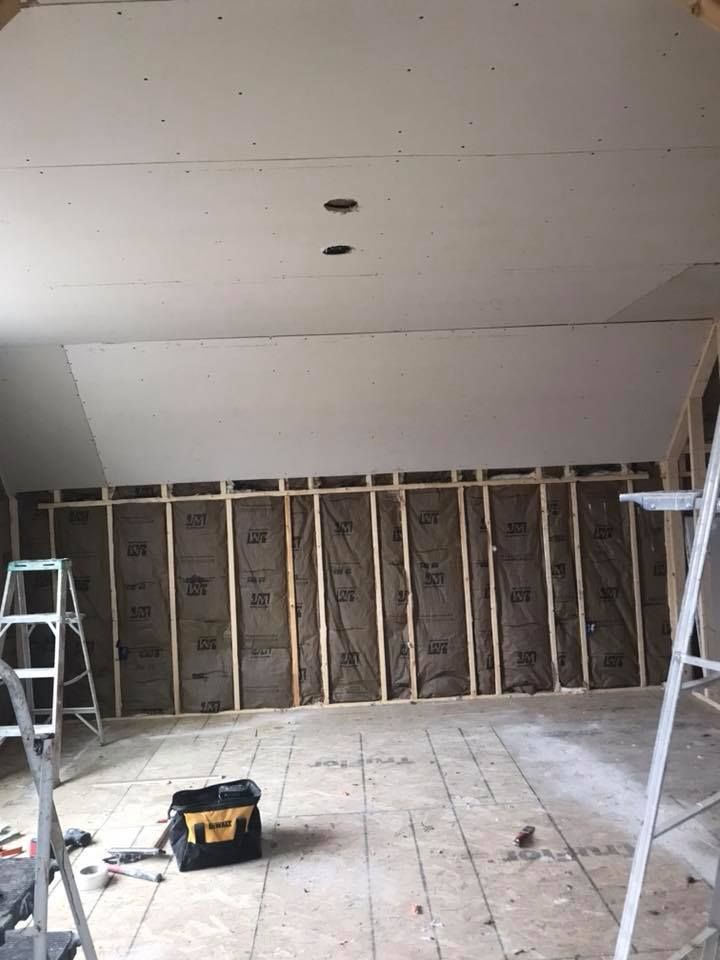 a large house is being built on a cloudy day .