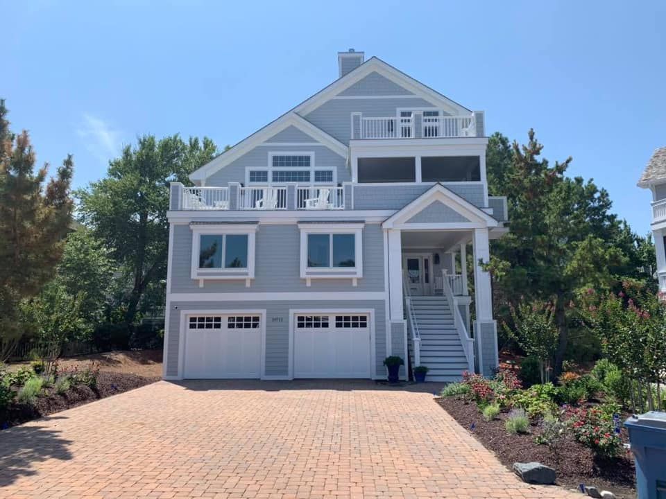 an empty room with a black tile floor and white walls