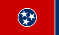 Tennessee state flag: Red field with a centered white-bordered blue circle containing three white stars. Blue vertical stripe on the right.