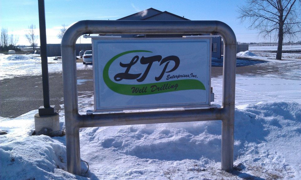 A sign that says ltp on it in the snow