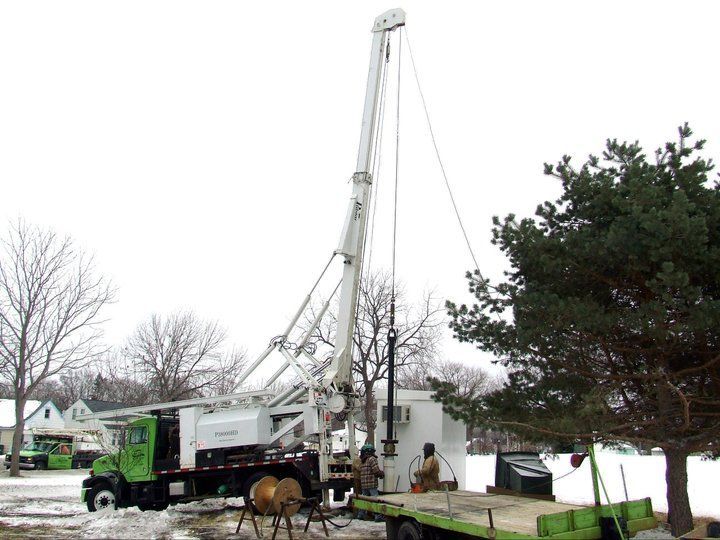 A truck with a crane on the back of it