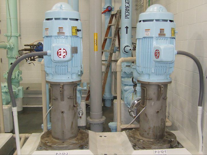 Two blue motors are sitting next to each other in a room