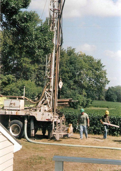A group of men are working on a drilling rig