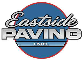 Eastside Paving logo over a blue circle with road and field background