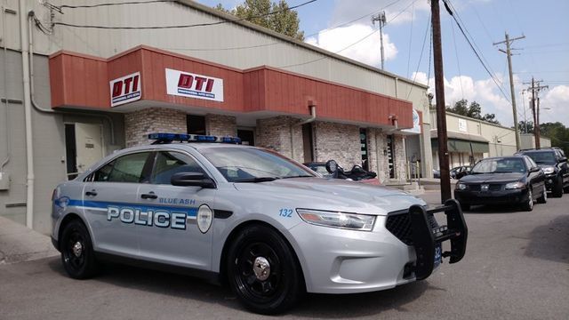 Police car parked in front of a building with 