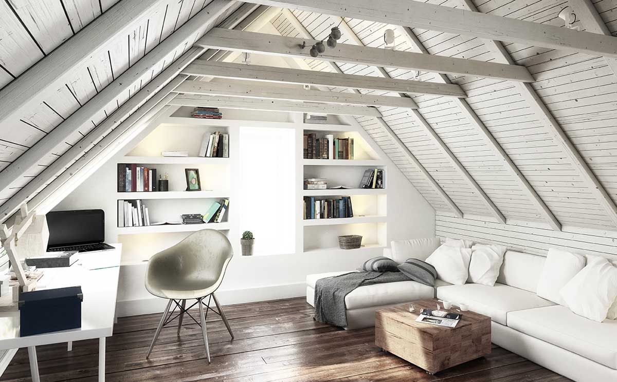 A living room in an attic with a couch, chair, desk and shelves.