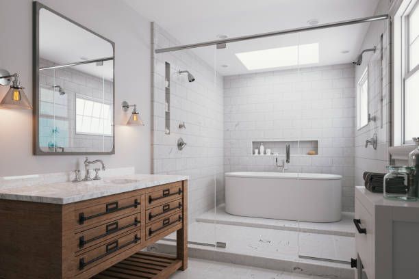 A bathroom with two sinks, a tub, and a shower.