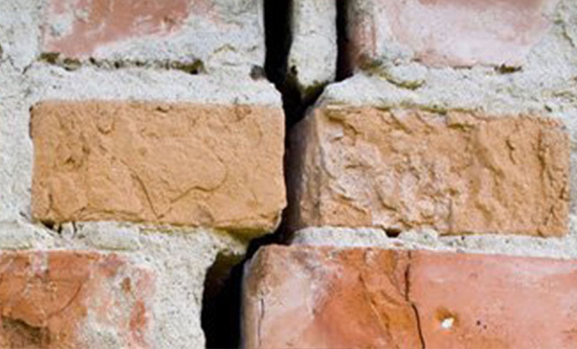 a cracked brick wall