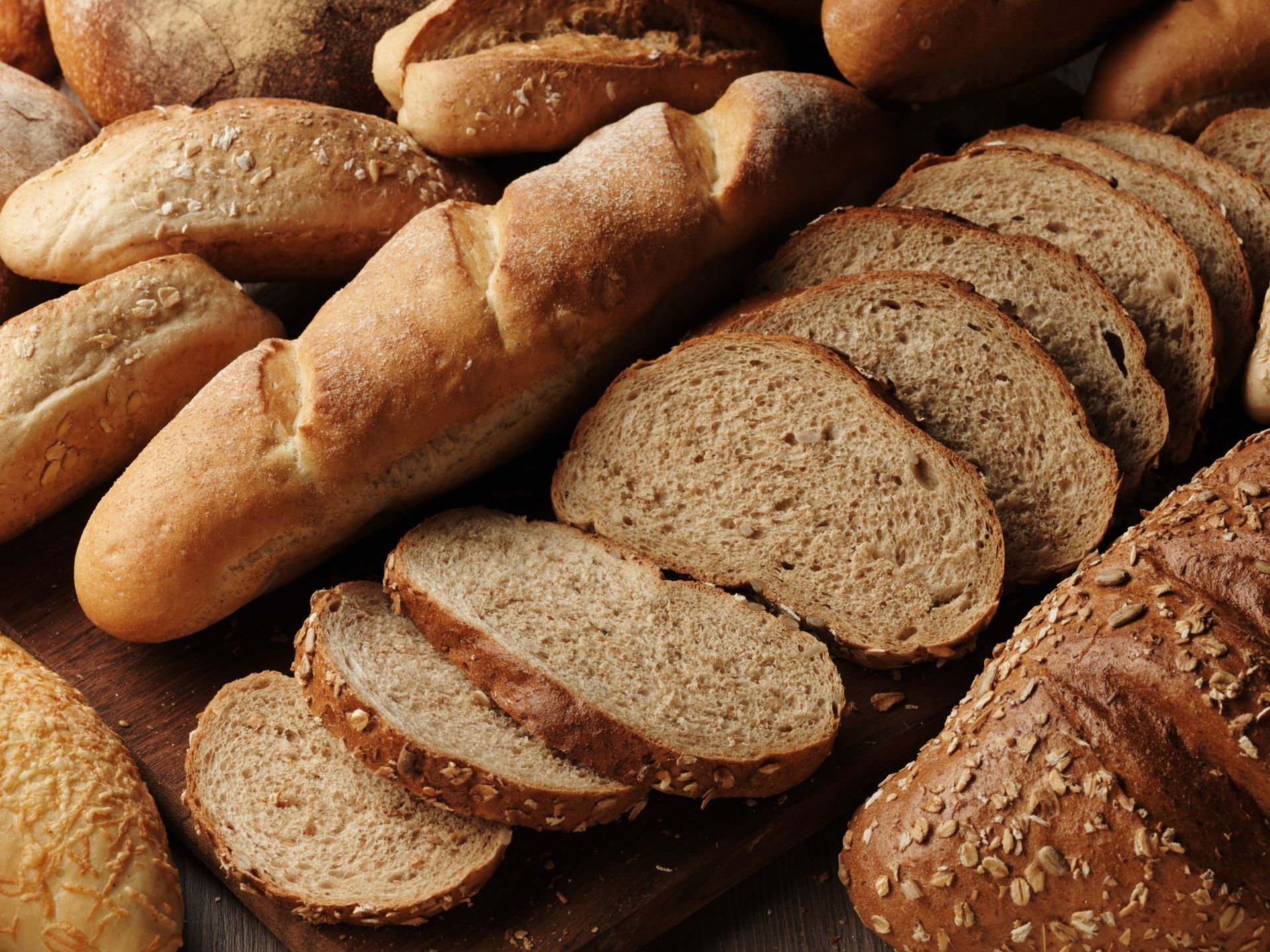 A bunch of different types of bread are on a table