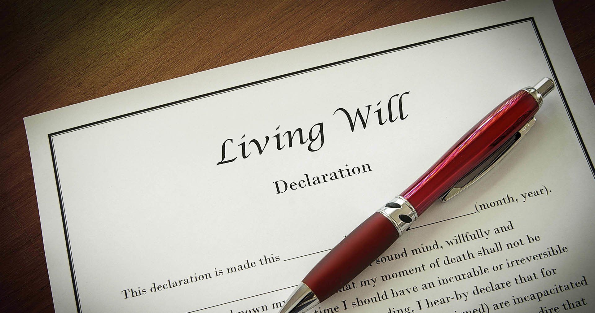 A red pen is sitting on top of a living will