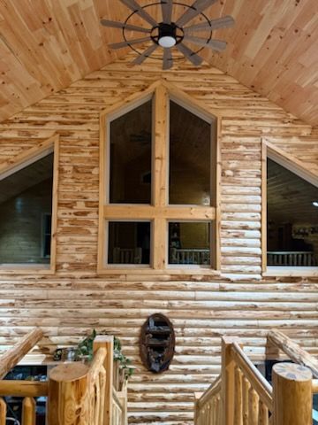 A log cabin with a high ceiling