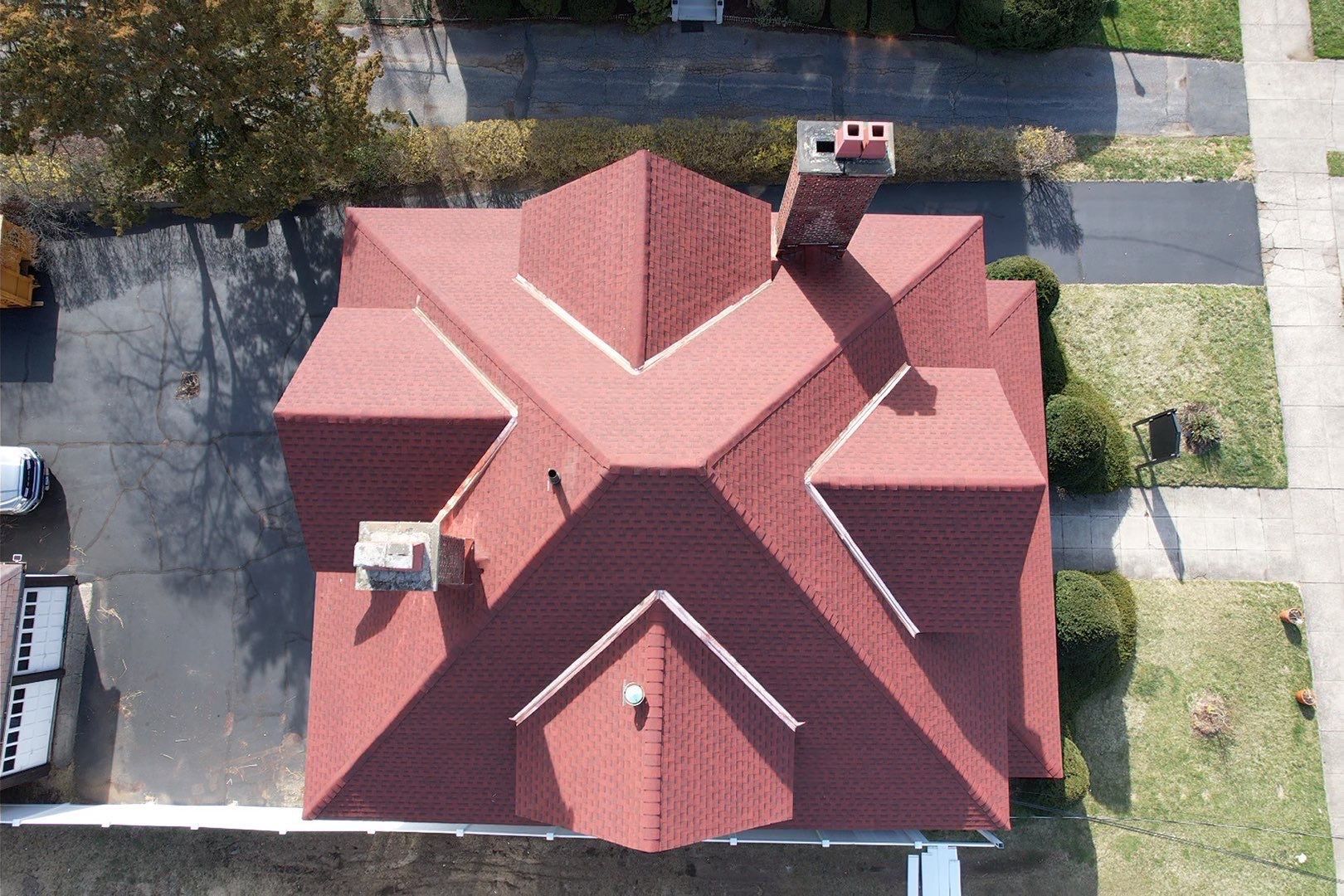 An aerial view of a house with a red roof.