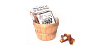 A small wooden basket filled with paper money and cash sticks on a white background.
