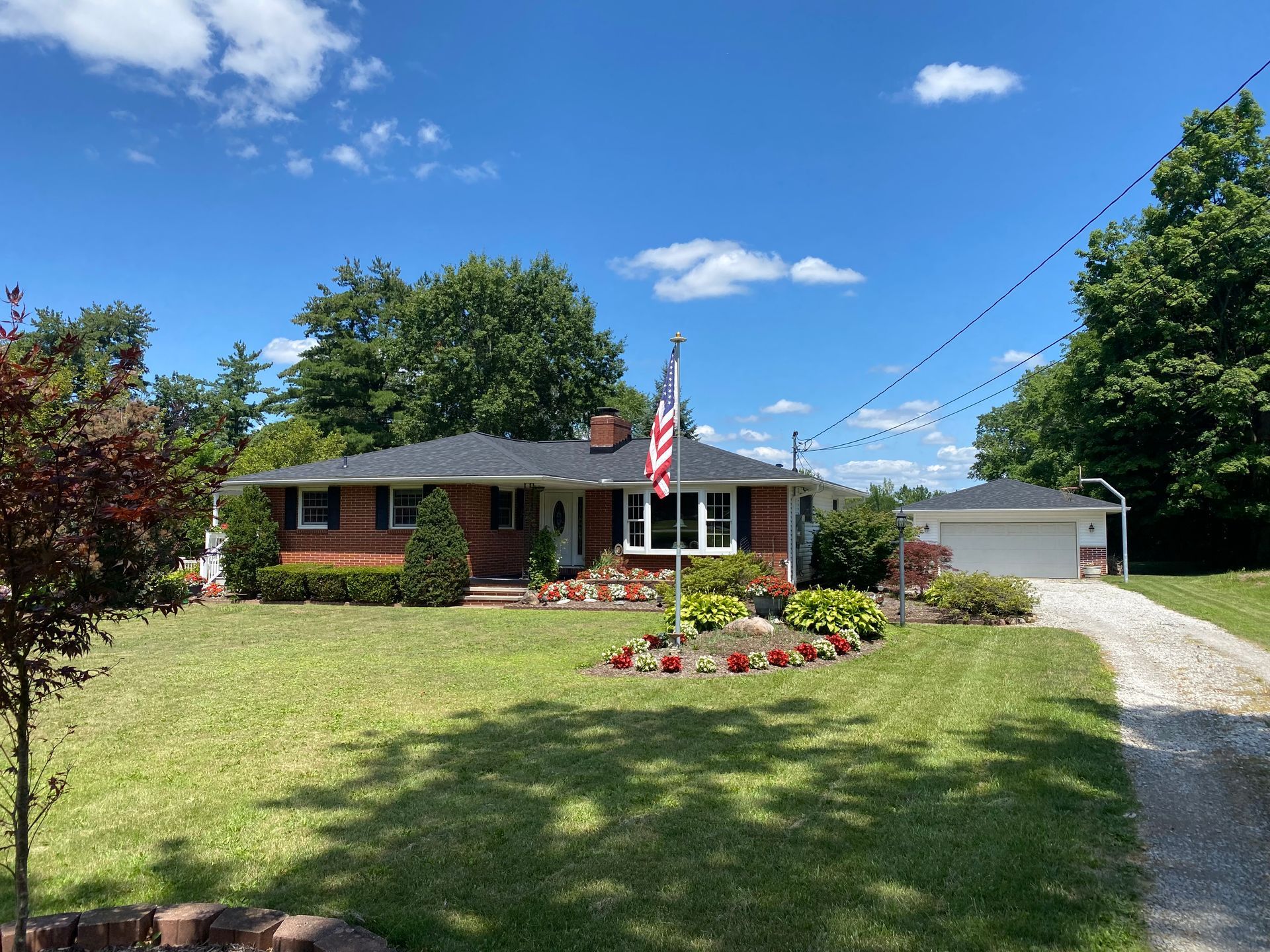 House with garden and American Flag.