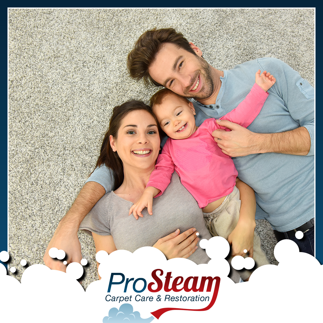 Family laying on carpet