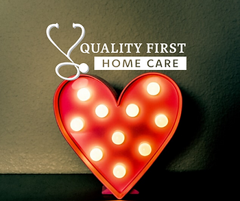 A red heart with white polka dots and the words quality first home care