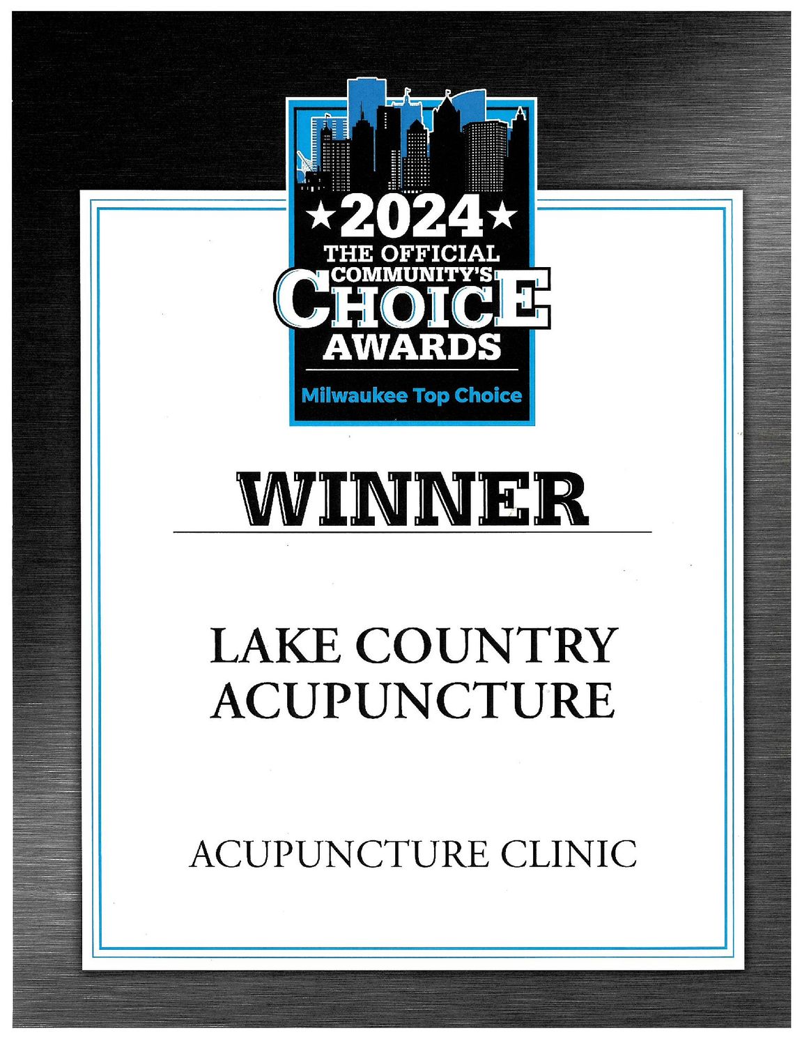 A plaque that says winner lake country acupuncture