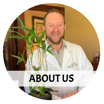 A man in a lab coat holding a plant with the words about us below him