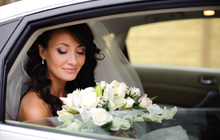 Bride inside limousine