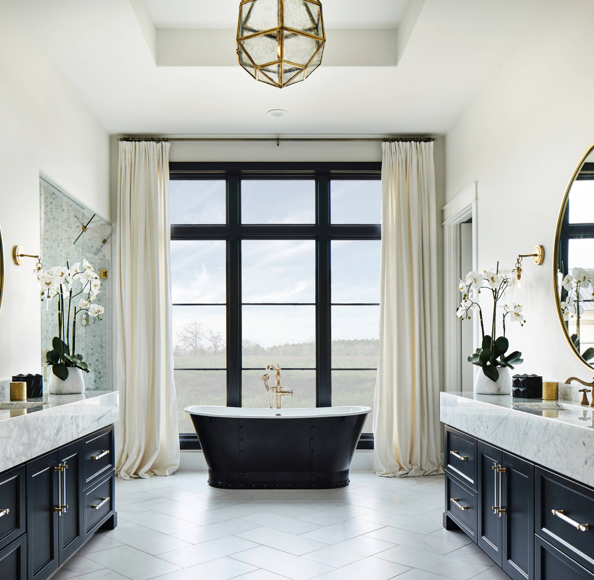 A large brick house with a patio in front of it.