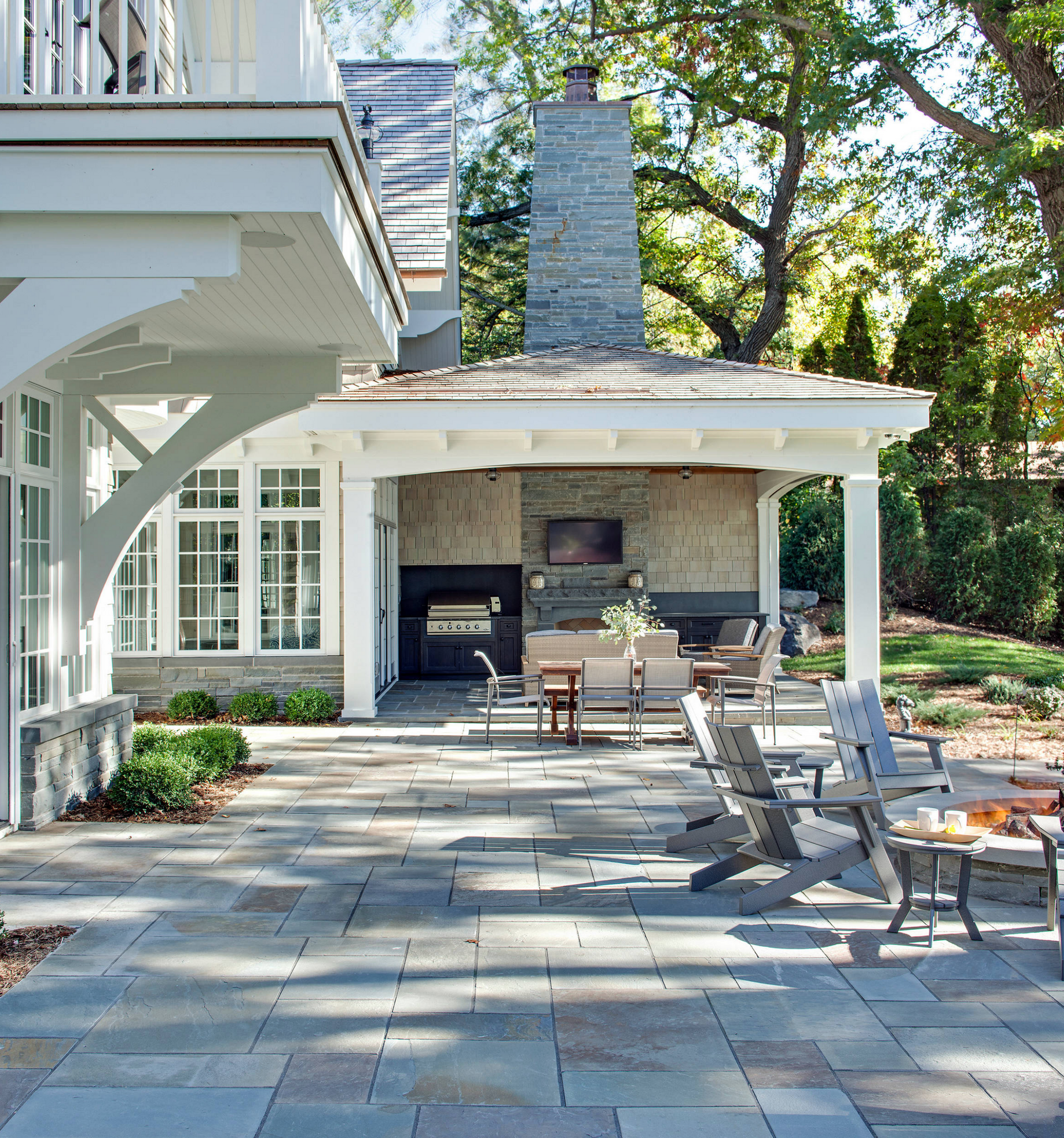 A house with a garage and a sidewalk in front of it.