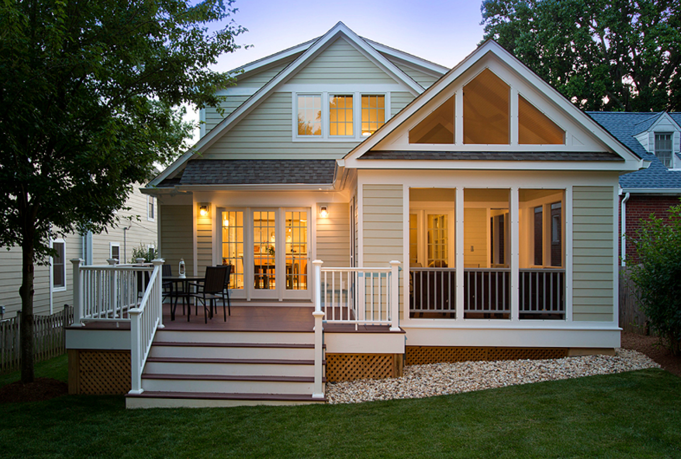 A blue house with a black door and steps