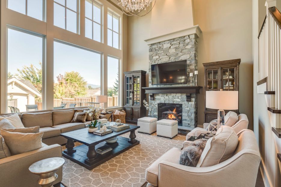 A living room filled with furniture and a fireplace