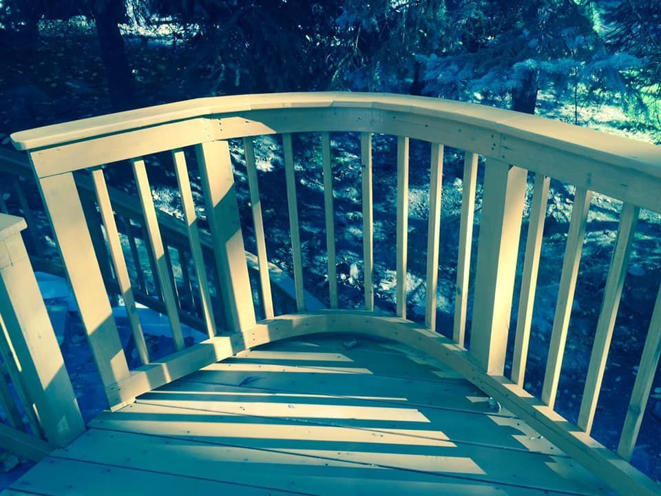 A wooden bridge with a blue sky in the background