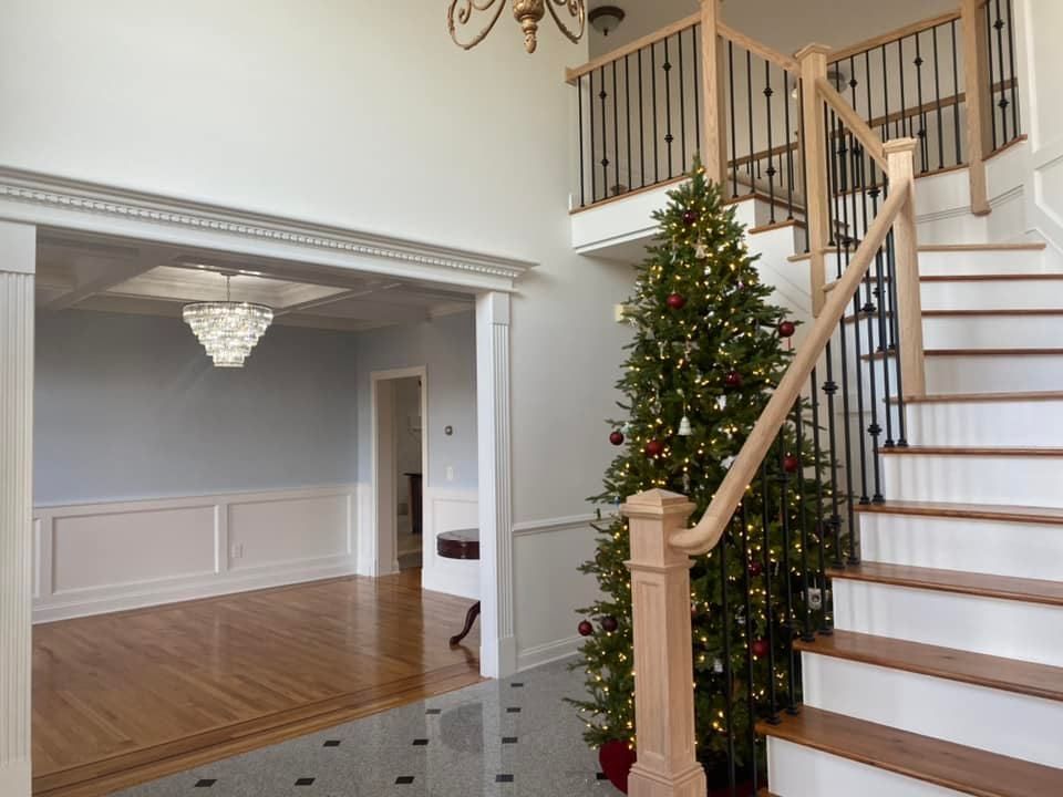 A staircase with a christmas tree in the middle of it