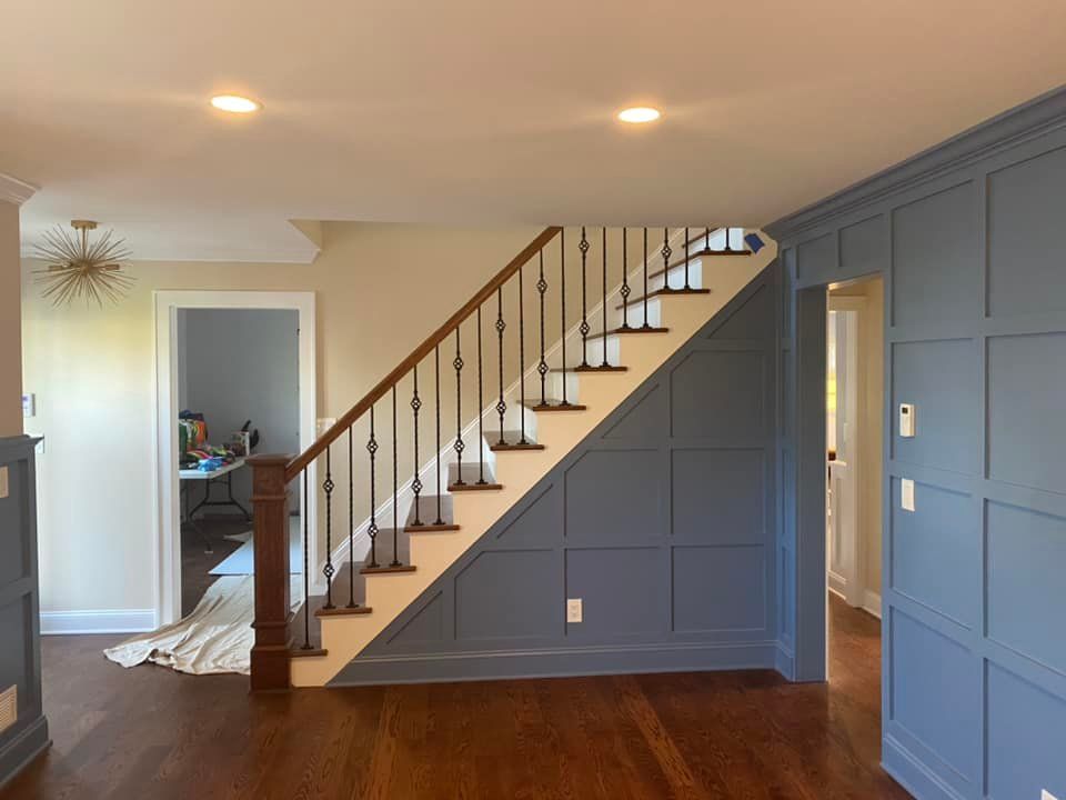 A staircase in a house with a wooden railing