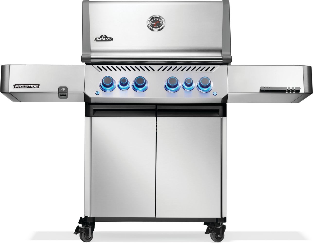 A person is cooking food on a stainless steel grill.